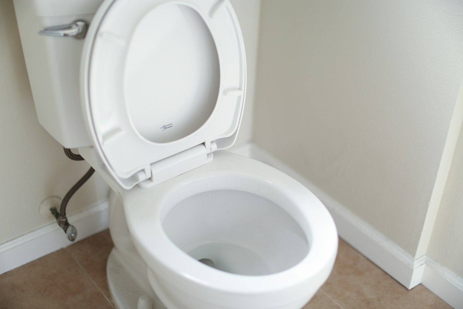 A white toilet in a bathroom